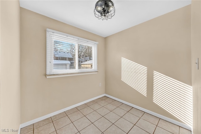 empty room with light tile patterned flooring