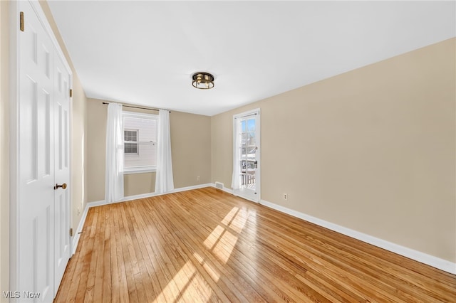 spare room featuring hardwood / wood-style flooring