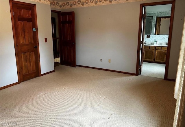 spare room with light carpet