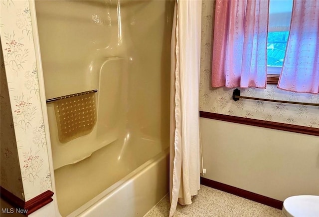 bathroom with shower / bath combination with curtain