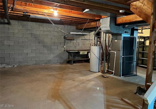 basement with gas water heater and heating unit