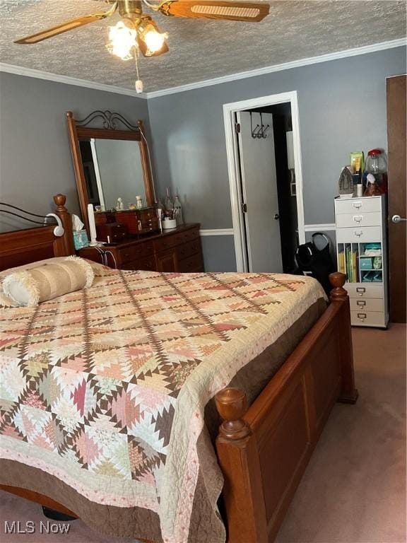 bedroom with crown molding, carpet flooring, a textured ceiling, and ceiling fan