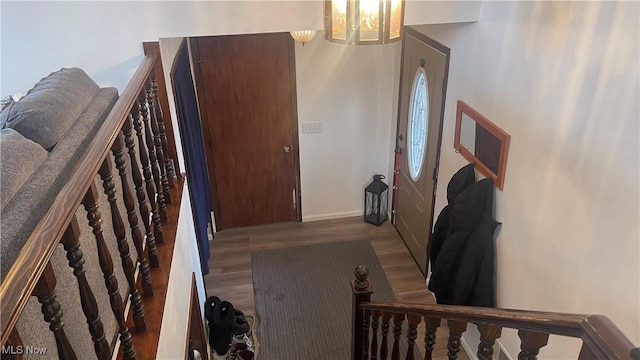 entrance foyer featuring hardwood / wood-style flooring and a chandelier