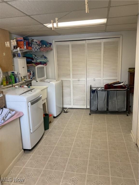 clothes washing area with washer / dryer