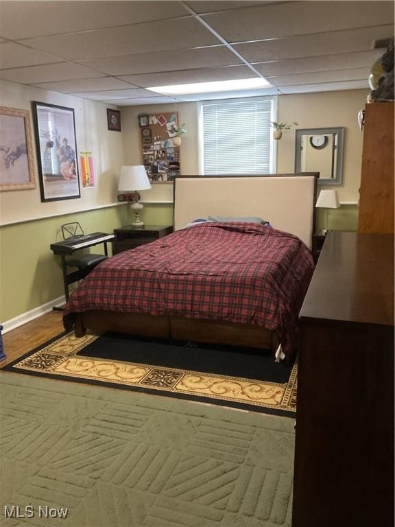 bedroom with a paneled ceiling