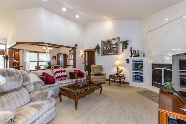 living room featuring a notable chandelier, vaulted ceiling, and light colored carpet