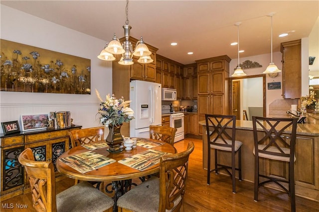 dining room with dark hardwood / wood-style flooring