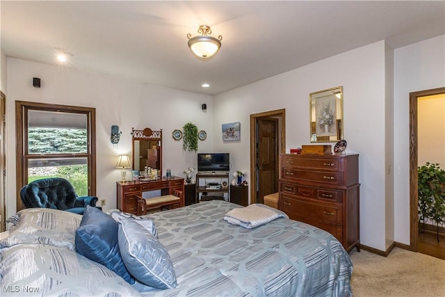 bedroom featuring light carpet