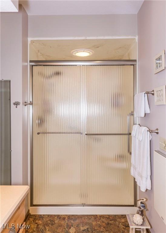 bathroom with an enclosed shower