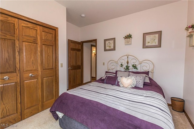 carpeted bedroom featuring a closet