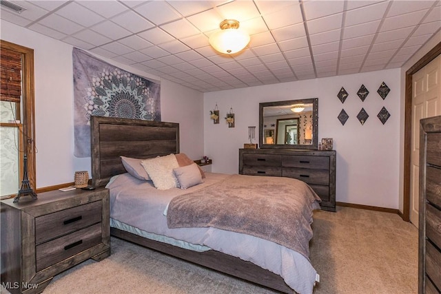 bedroom with light colored carpet