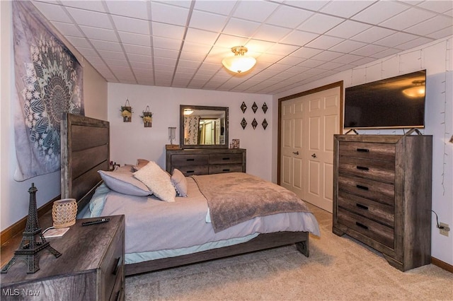 carpeted bedroom featuring a closet