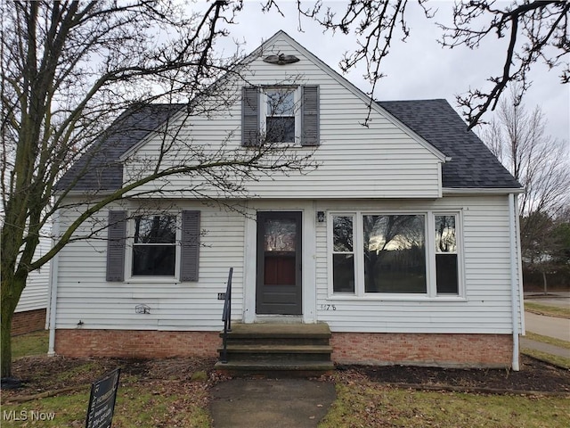 view of front of property featuring a shingled roof and entry steps