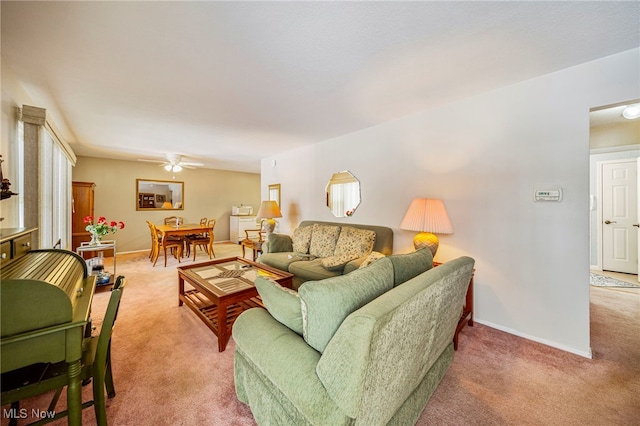 living room with light carpet and ceiling fan