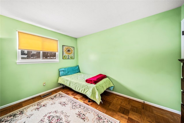 bedroom with parquet floors