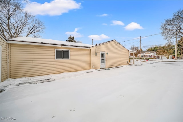 view of snow covered house