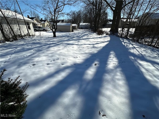 view of yard layered in snow