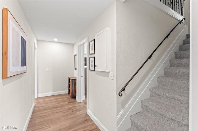 stairs with wood-type flooring