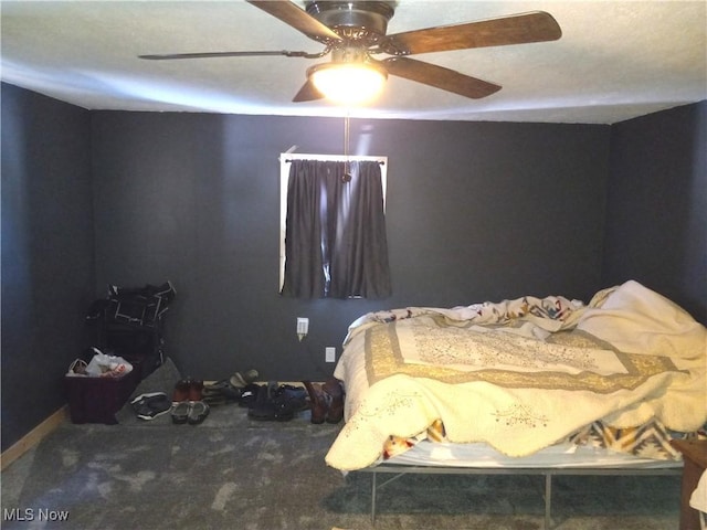 bedroom with ceiling fan and carpet