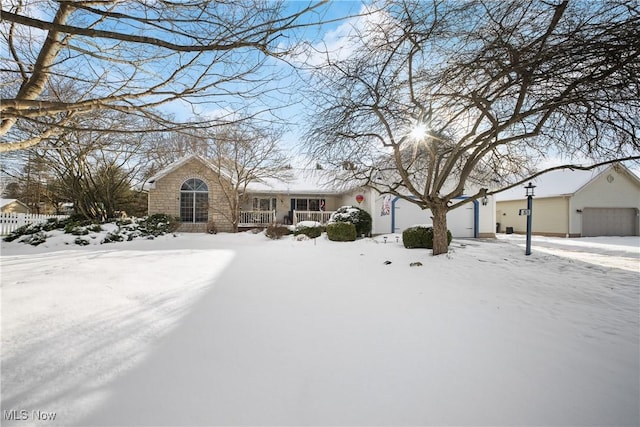 view of front of property featuring a garage and covered porch