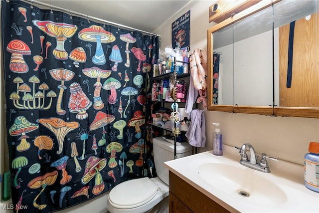 bathroom with vanity, a shower with curtain, and toilet