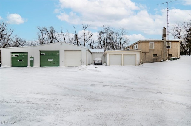 view of snow covered garage