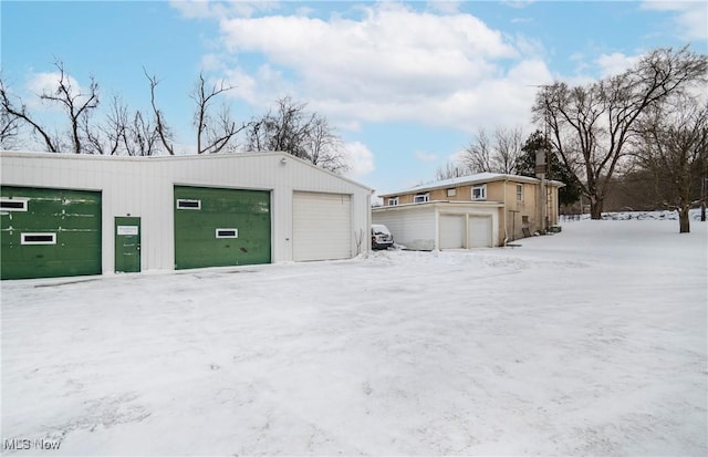 view of snow covered garage