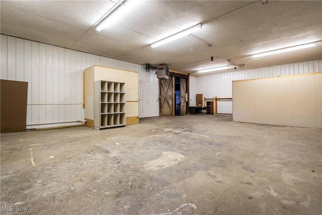 basement featuring a wall unit AC