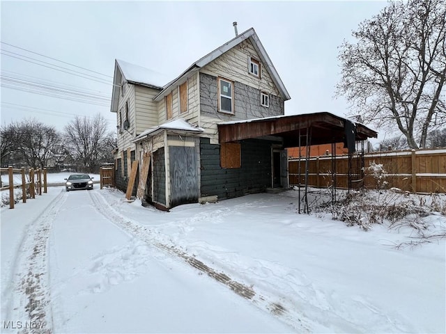 view of snow covered property