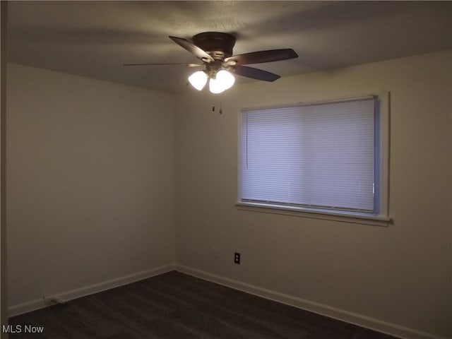 carpeted empty room with ceiling fan