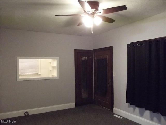 empty room featuring ceiling fan