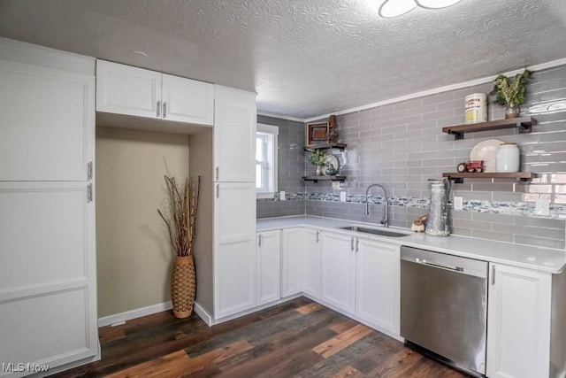 kitchen with sink, stainless steel dishwasher, dark hardwood / wood-style floors, and white cabinets