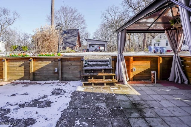 exterior space with a gazebo and a patio