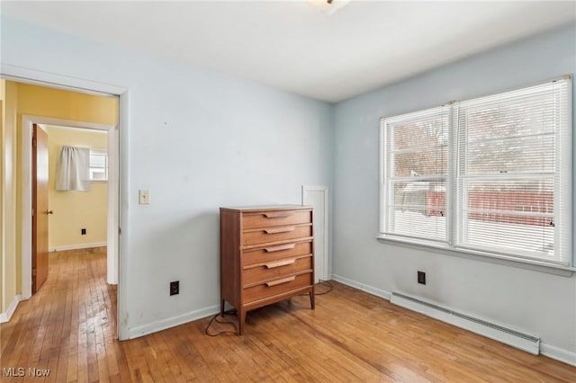 interior space featuring light hardwood / wood-style floors and baseboard heating