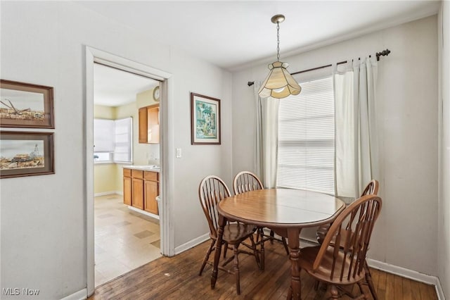 dining area featuring dark hardwood / wood-style flooring