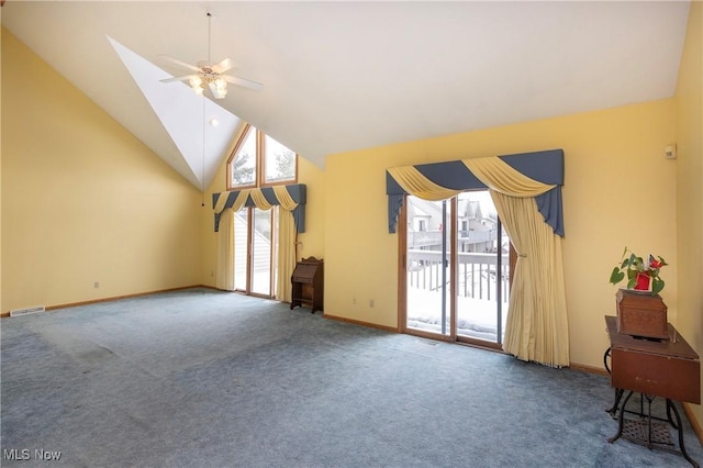 living room with ceiling fan, carpet floors, and high vaulted ceiling