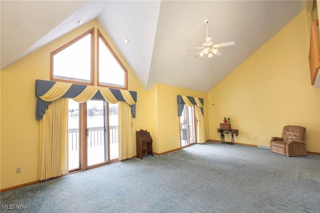 interior space featuring ceiling fan, high vaulted ceiling, and carpet floors