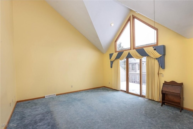 additional living space featuring lofted ceiling and dark carpet