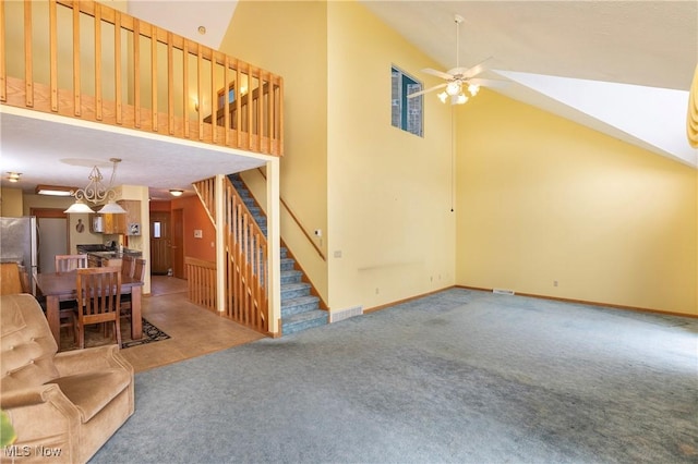 carpeted living room featuring vaulted ceiling and ceiling fan