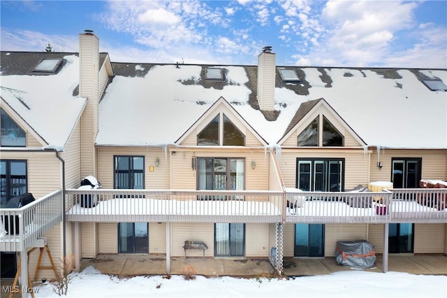 view of snow covered property