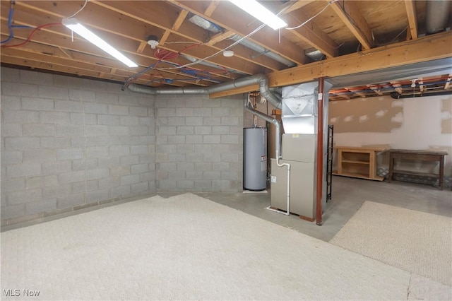 basement featuring heating unit and water heater