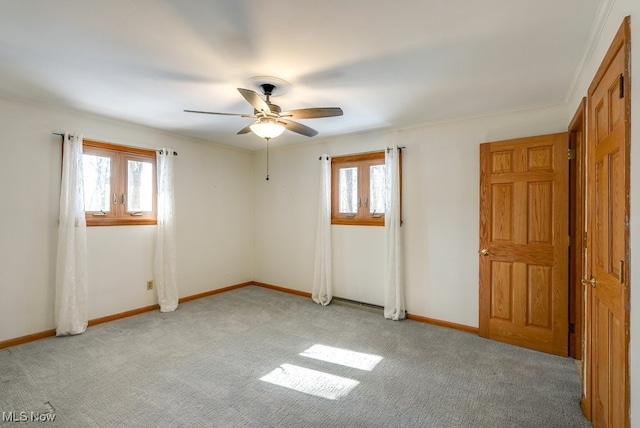 carpeted empty room with ceiling fan