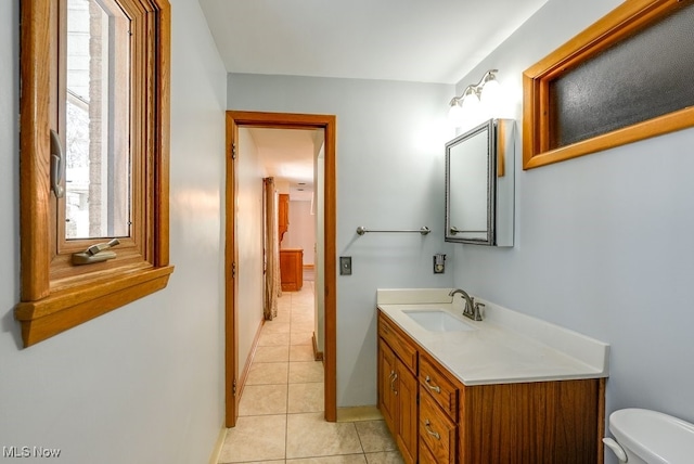 bathroom with tile patterned floors, toilet, and vanity