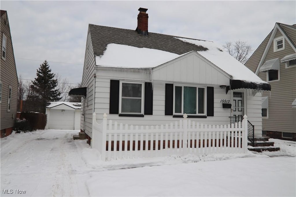 view of front of home featuring an outbuilding and a garage