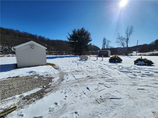 view of yard layered in snow