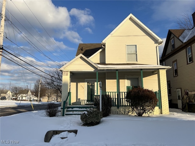 view of front of property featuring covered porch