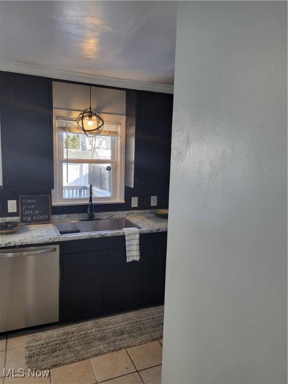 kitchen featuring light tile patterned flooring, sink, hanging light fixtures, stainless steel dishwasher, and ornamental molding