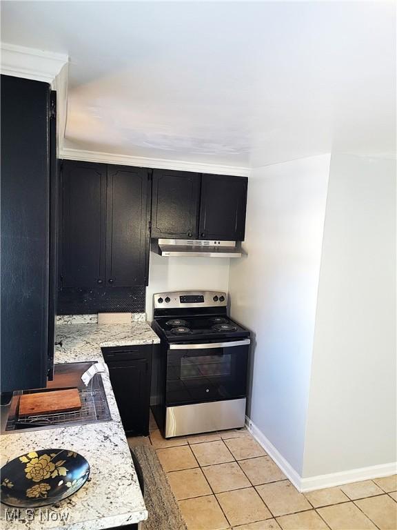 kitchen featuring ornamental molding, stainless steel electric range oven, light stone countertops, and light tile patterned floors