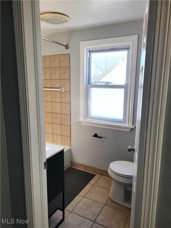 bathroom featuring tile patterned floors, toilet, and vanity