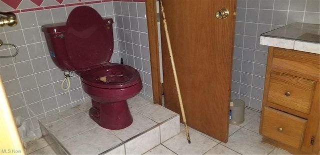 bathroom with vanity, tile walls, and tile patterned floors